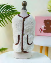 Fleece vest with brown trim — supplier reference